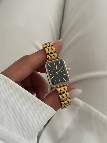 ساعت دنیل طلایی صفحه مشکی استیل زنانه